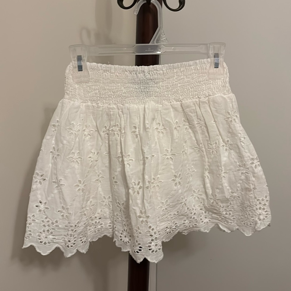 Eyelet lace flared white mini skirt